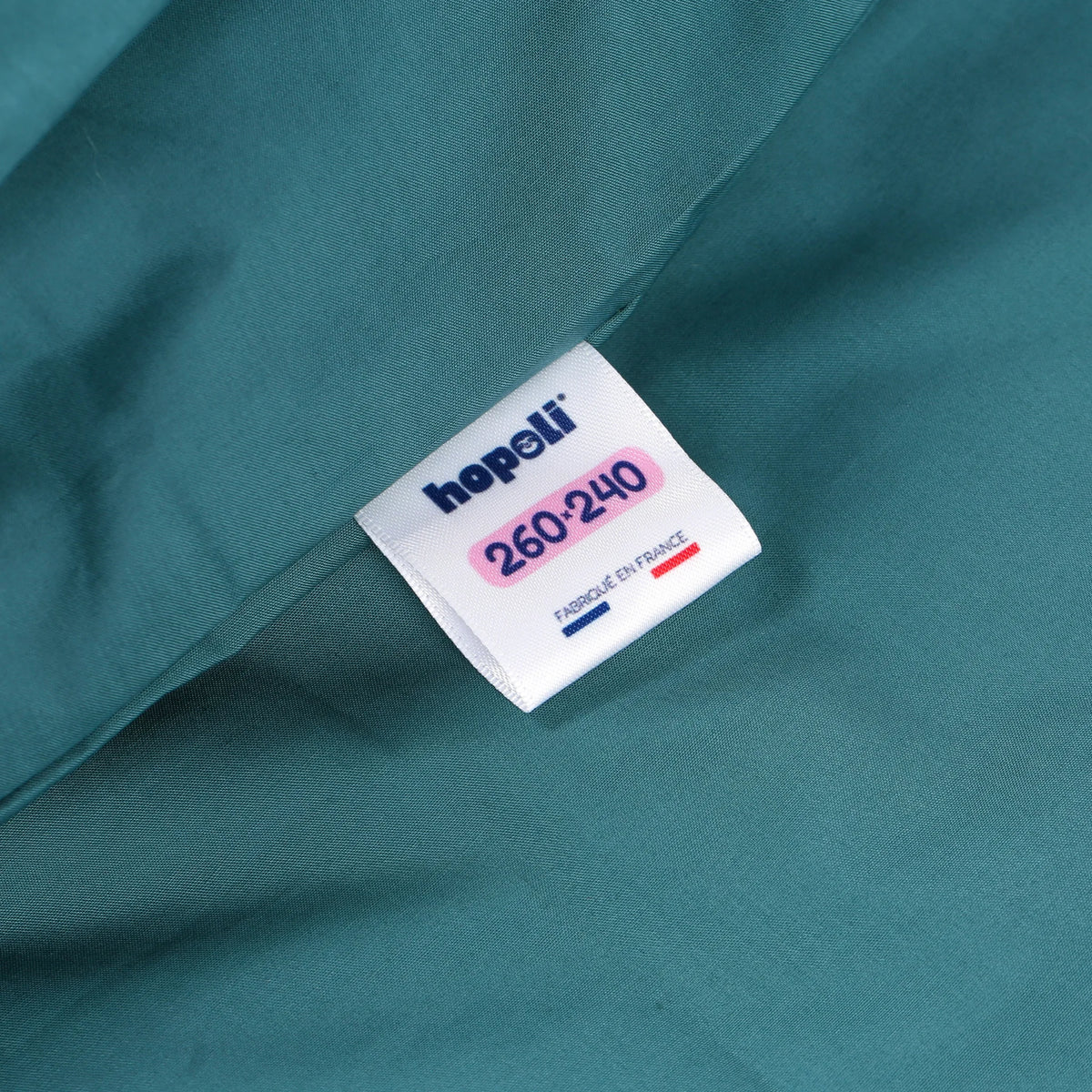 Photo de l'étiquette de taille sur notre housse de couette anti-galère Hopoli (Forêt)